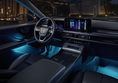 Deep blue Ambient Lighting glows from various places within a 2026 Lincoln Aviator® SUV. | Lincoln of Troy in Troy MI
