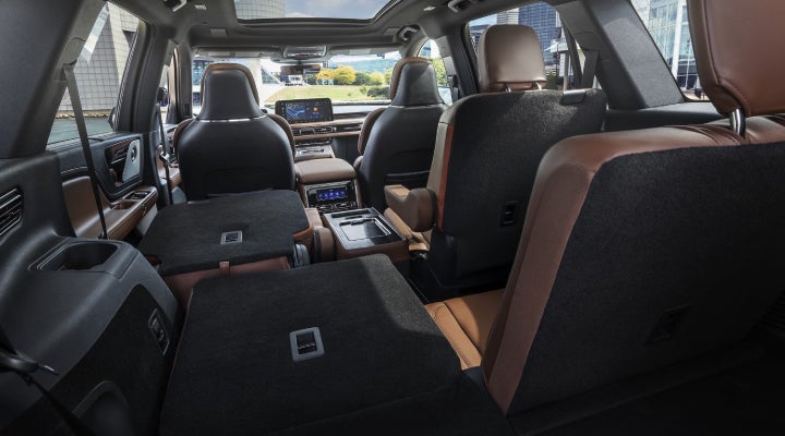 One side of the PowerFold® third-row seat and a second-row seat are folded forward in the 2026 Lincoln Aviator® SUV. | Lincoln of Troy in Troy MI