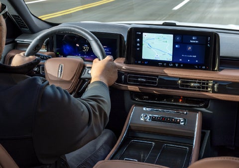 A person is driving a 2026 Lincoln Aviator® SUV as seen from inside the cabin. | Lincoln of Troy in Troy MI