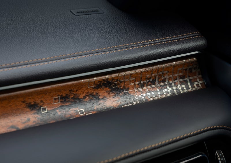 A close-up shot of the 2026 Lincoln Aviator® dashboard with unique black and brown accents and brown stitching. | Lincoln of Troy in Troy MI
