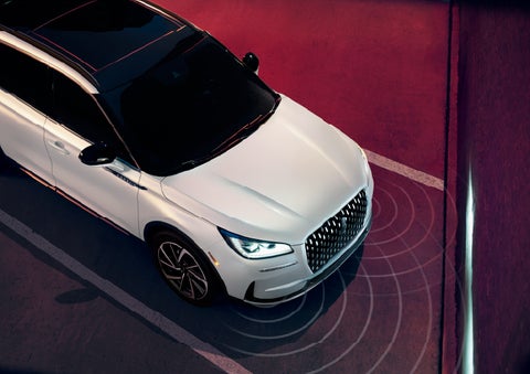 Simulated radar signals are shown emitting from the front of a 2026 Lincoln Corsair® SUV. | Lincoln of Troy in Troy MI