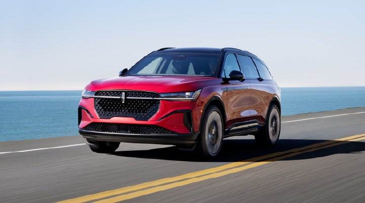 A 2026 Lincoln Nautilus® SUV is being driven on a seaside roadway. | Lincoln of Troy in Troy MI