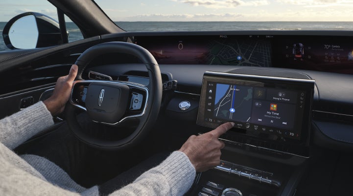 The driver of a 2026 Lincoln Nautilus® SUV interacts with the new Lincoln Digital Experience. | Lincoln of Troy in Troy MI