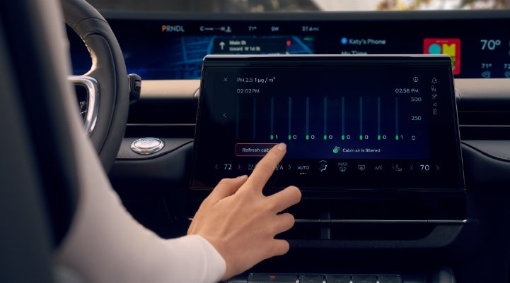 A woman is shown using the Auto Air Refresh feature in the 2026 Lincoln Nautilus® SUV. | Lincoln of Troy in Troy MI