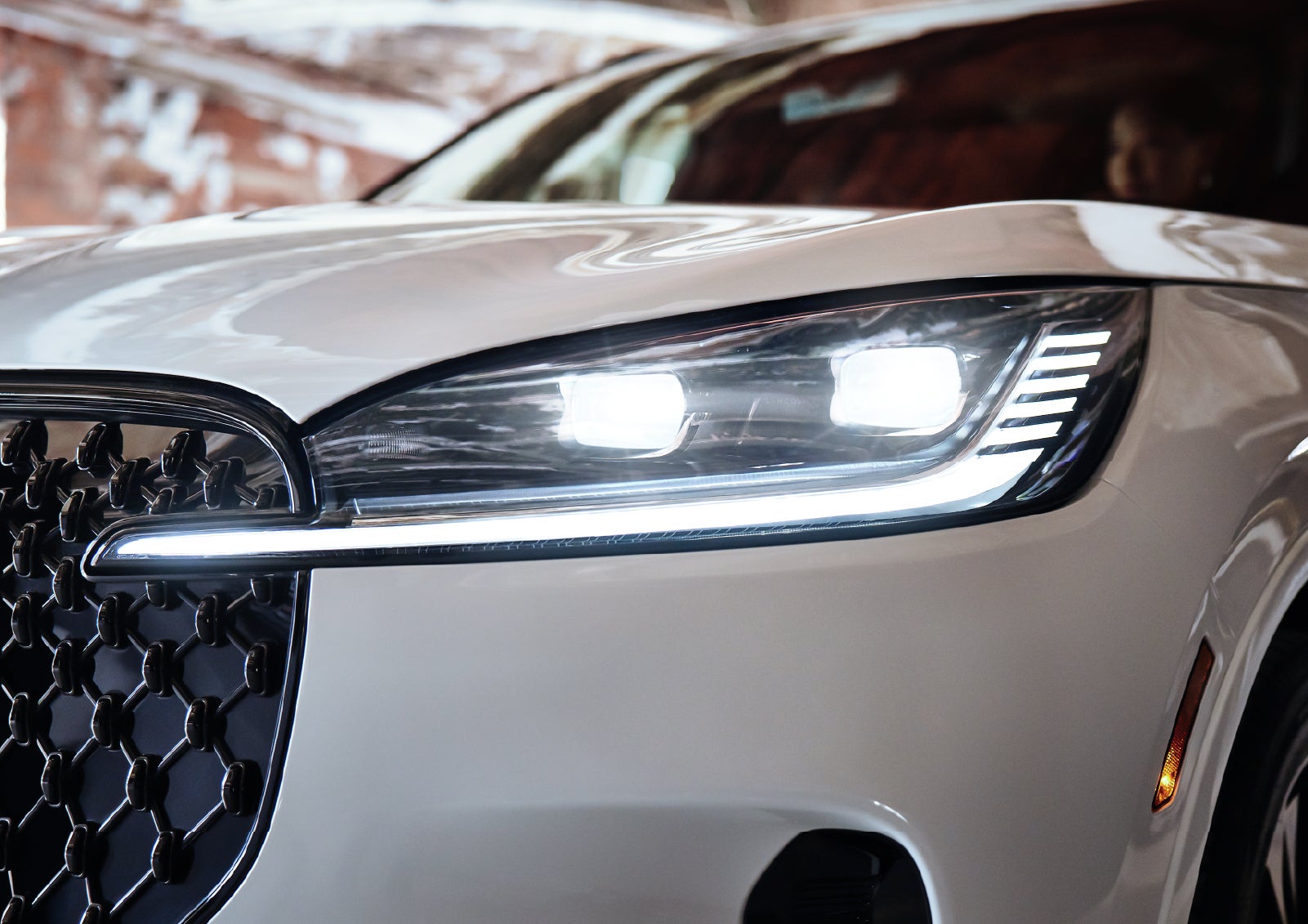 A close-up of a headlamp on the 2027 Lincoln Aviator® SUV is shown. | Lincoln of Troy in Troy MI