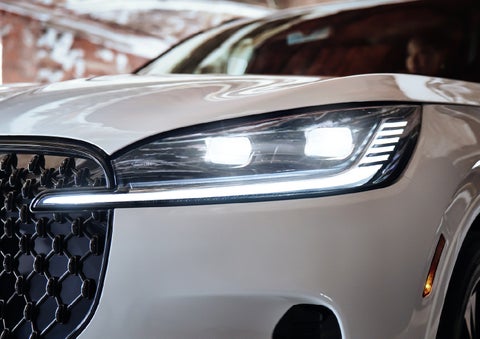 A close-up of a headlamp on the 2027 Lincoln Aviator® SUV is shown. | Lincoln of Troy in Troy MI