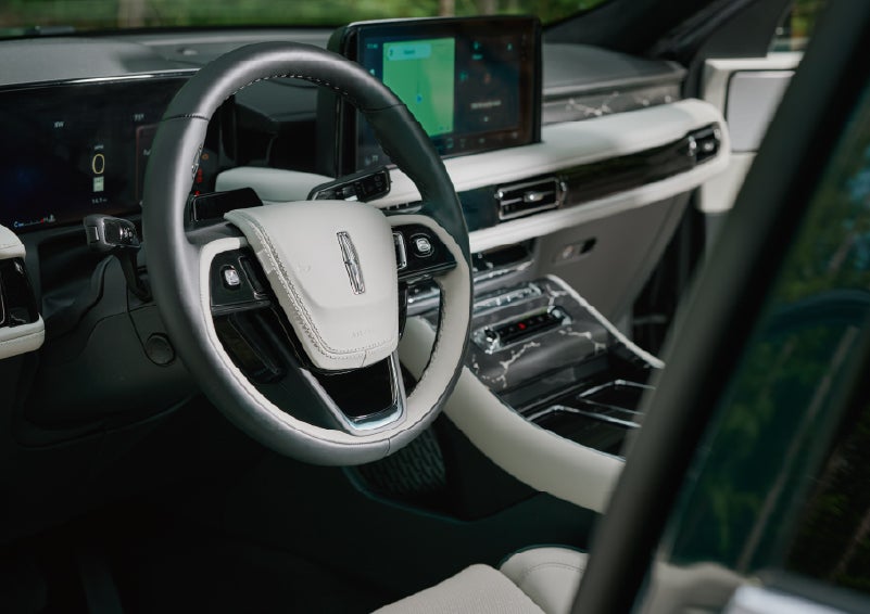 The leather-trimmed steering wheel of a 2027 Lincoln Aviator® Black Label™ SUV. | Lincoln of Troy in Troy MI