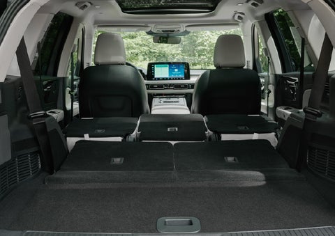 A rear to front view of the interior of a 2027 Lincoln Aviator® Black Label™ SUV shows the third and second rows folded flat | Lincoln of Troy in Troy MI