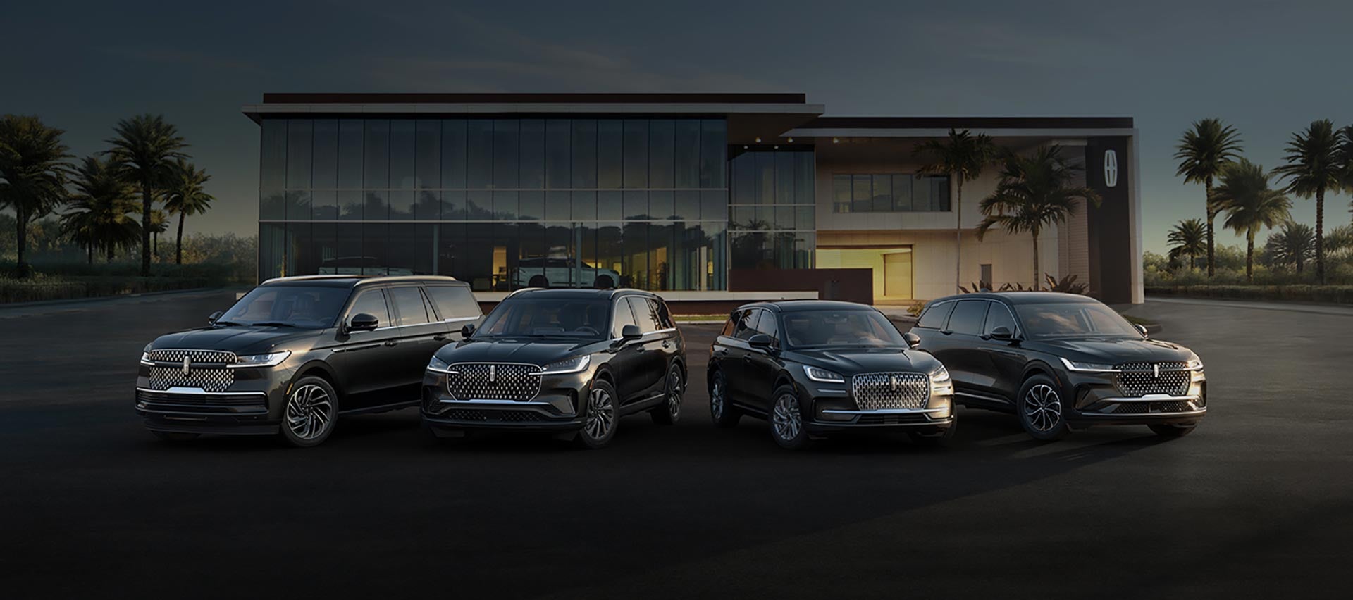 A group of Lincoln SUVs are parked in front of a Lincoln Dealer parking lot.