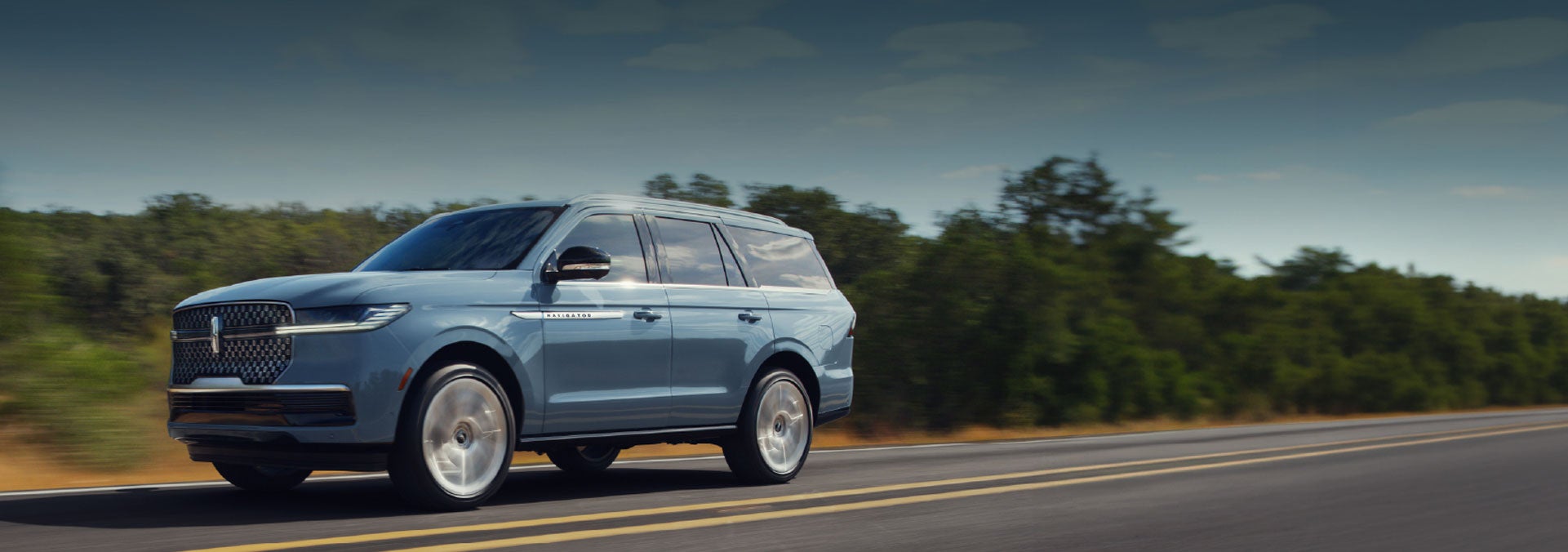 A 2026 Lincoln Nautilus® SUV is being driven on a desert highway.