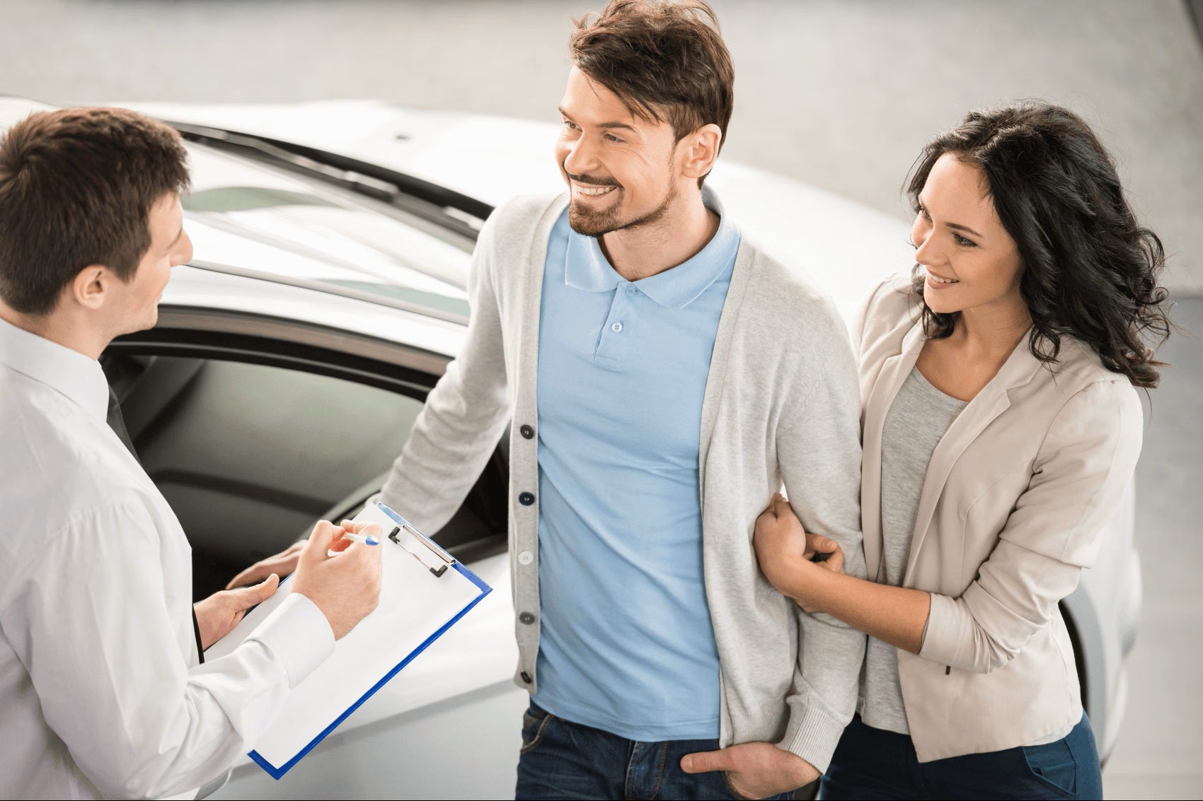Sales rep talking to customers in showroom