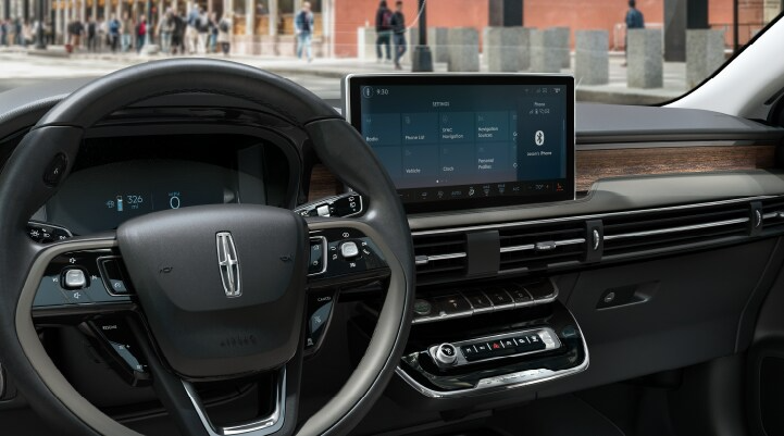 The center screen of the new 2025 Lincoln Corsair SUV is showcased with its SYNC 4 capabilities highlighted.