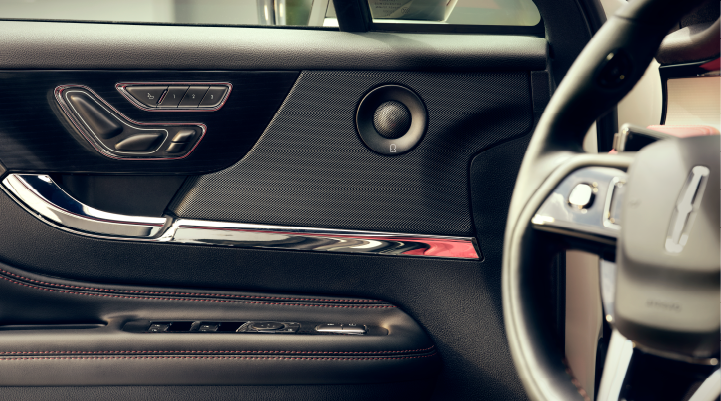 A Revel audio speaker is shown in the driver’s side door of a 2025 Lincoln Corsair SUV.